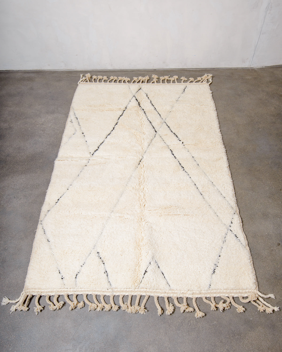 Modern, designer, handcrafted Berber rug from Morocco. Beniourain carpet with minimalist design, natural wool pile and a fluffy texture.